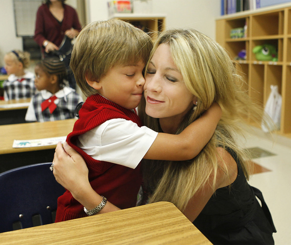 NEFIRSTDAY  AUGUST 23, 2011    Kindergartener Holden Port gives a big hug goodbye to his mom Elizabeth on the first day of school at Mars Hill Academy in Mason on Tuesday, August 23, 2011.  The Enquirer/Leigh Taylor