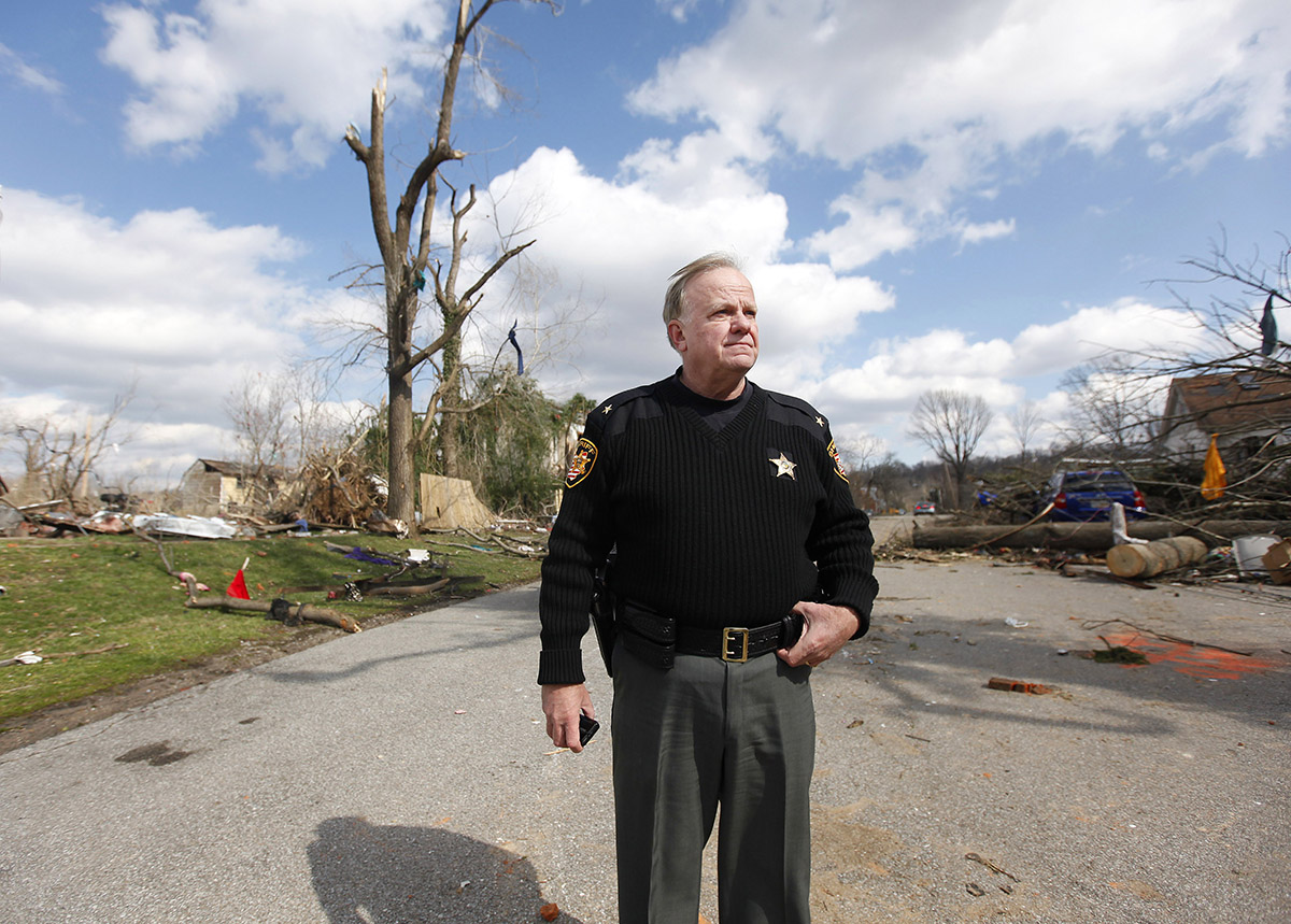 moscow   March 3, 2012   Clermont County Sheriff A.J. Roderberg checks out what is left of downtown Moscow on Saturday, March 3, 2012.  Moscow was devastated in yesterday's storms.   The Enquirer/Leigh Taylor