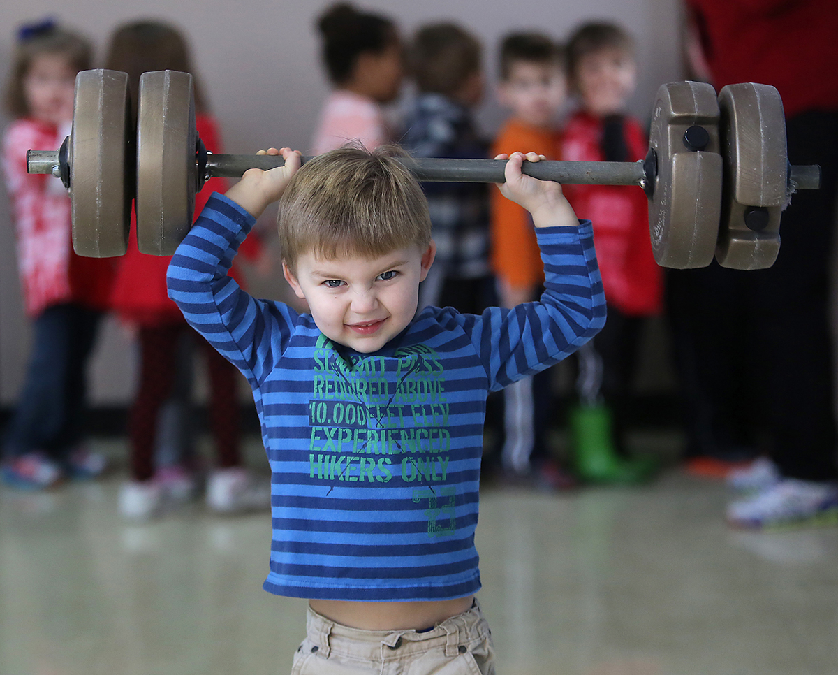 wnolympics  February 11, 2014   Bryce Cowell (cq) shows his strength during the Lakeview Olympics at Lakeview Preschool in Landen on Tuesday, February 11, 2014.   The kids had an opening ceremony, played games, and then the kids received medals.  The Enquirer/Leigh Taylor