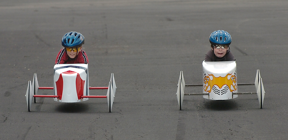 SOAPBOX  JUNE 6, 2006  Tyler Dockum, 9, left, races A. J. Newberry, 10, during practice runs for the Cincinnati Soapbox Derby, held on June 24 on Gilbert Avenue.  The kids could test their soapbox racers out at Business Center Drive off of Crescentville Road.  The Enquirer/Leigh Patton