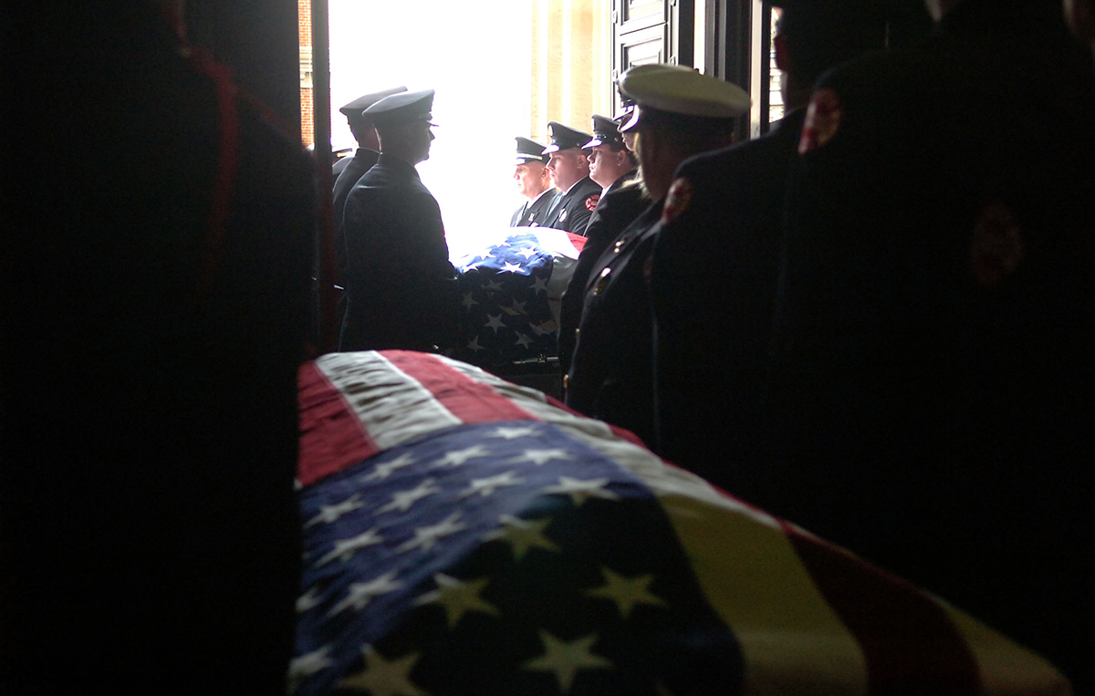 FUNERAL  APRIL 9, 2008  Pallbearers carry the caskets of Capt. Robin Broxterman and Brian Schira out of Saint Peter in Chains church.  The Enquirer/Leigh Taylor